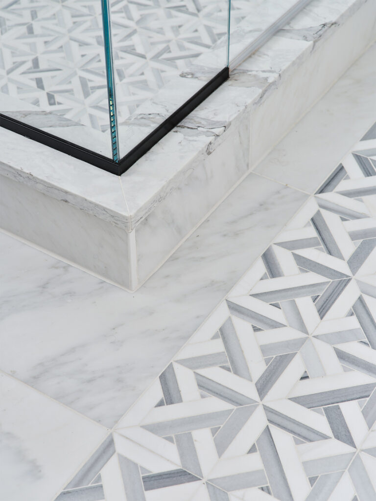 An intricate and elegant geometric tile design in a bathroom setting