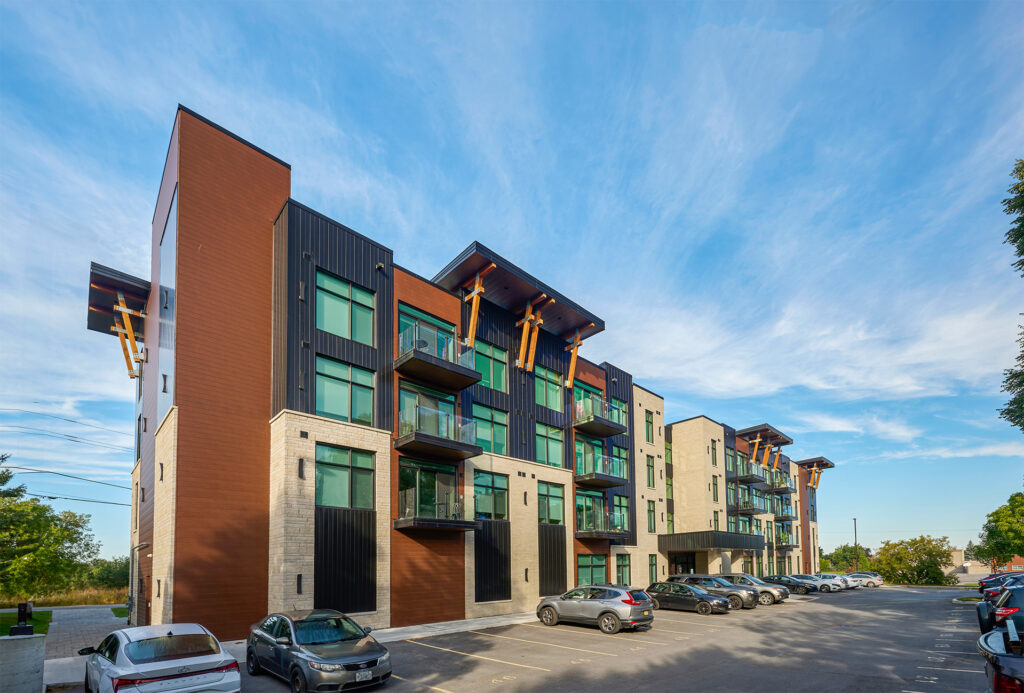 A modern multi-story residential building with striking wooden beams